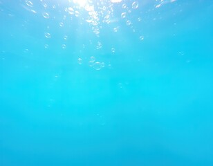 Underwater view showcasing vibrant blue water and rising bubbles.