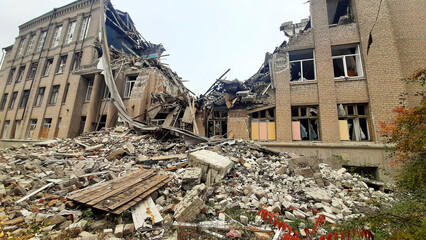destroyed and burned houses in the city during the war in Ukraine. broken house, Russian-Ukrainian war. a rocket hit a school, the educational institution was destroyed. Donetsk region © Oleksandr Filatov