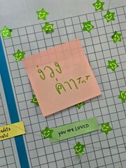 Colorful sticky notes on a grid, perfect for organization and reminders in creative and productive environments.