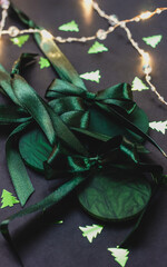 Green Christmas tree ornaments with satin bow, festive holiday decoration symbolizing seasonal joy and elegance in lush green hue