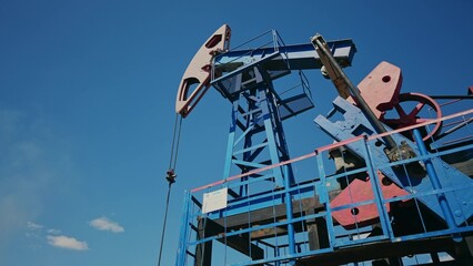 oil business. oil pump pumps out of the ground resource extraction. industry mechanism business oil...