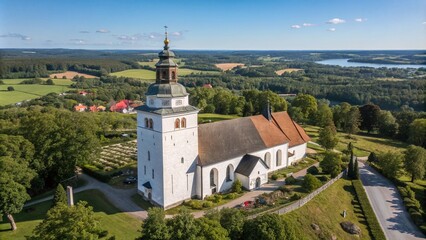 Stunning Drone Photography of Tocksfors’ Old White Stommen Church on a Sunny Summer Day, Capturing the Local Landmark in a Beautiful Panorama of Sweden’s Scenic Landscape