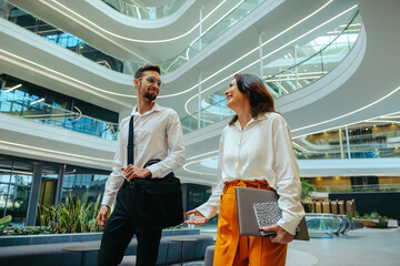 Corporate colleagues discussing innovation in a contemporary office building