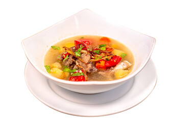 Hot lamb soup with fried onion and celery leaves. Mixed with potatoes, carrots and fresh red tomato slices. Isolated on white background. Perfect for menu, catalogue, advertising or commercial use