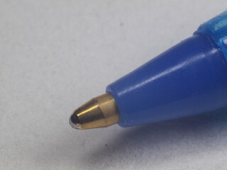 In the photo - Ballpoint pen. Stationery. Office Macrophotography.