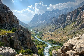 Fototapeta premium Breathtaking mountain valley with a winding river under blue skies