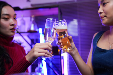 food and drink male friends are happy drinking beer and clinking glasses at a bar or pub.