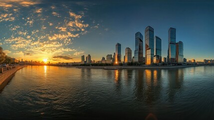 Obraz premium Panoramic view of a modern cityscape with skyscrapers reflected in the water at sunset.