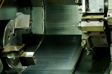 Metal machine tools industry. CNC turning machine high-speed cutting is operation.turret head in...