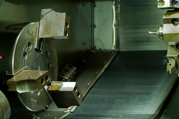 Metal machine tools industry. CNC turning machine high-speed cutting is operation.turret head in black