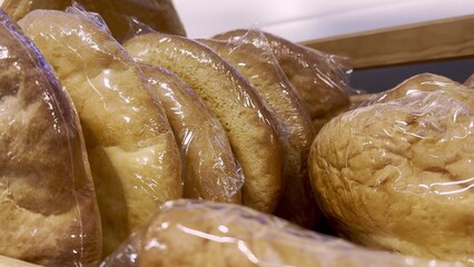 bread in the supermarket on the shelf. close-up of bread for sale on a shelf in a store. bakery products bakery concept. delicious fresh bread for breakfast
