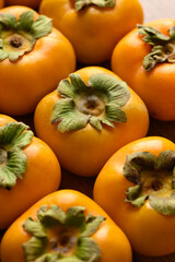 Ripe persimmon fruit texture background, Autumn fruit