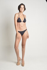 short hair, natural, no makeup, woman, white t-shirt, black pants, blue swimsuit, bikini, skates, casual, authentic, lifestyle, candid, minimal, female model, simplicity, everyday look, relaxed, comfo