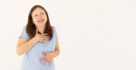 Portrait of extremely happy girl in blue t-shirt holding her stomach and chest and laughing out loud, chuckling giggling at amusing anecdote, sincere emotion. isolated on white background