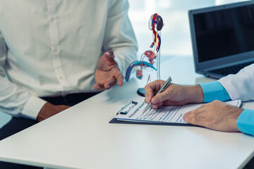 A young man is consulting a doctor about the causes of erectile dysfunction in the examination...