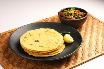 Makai roti with Sarson ka saag, also known as sarsa da saag, is a dish of mustard greens cooked with spices. It originated in the Punjab region and is popular throughout the South Asia.