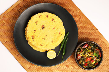 Makai roti with Sarson ka saag, also known as sarsa da saag, is a dish of mustard greens cooked with spices. It originated in the Punjab region and is popular throughout the South Asia.