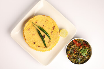 Makai roti with Sarson ka saag, also known as sarsa da saag, is a dish of mustard greens cooked with spices. It originated in the Punjab region and is popular throughout the South Asia.