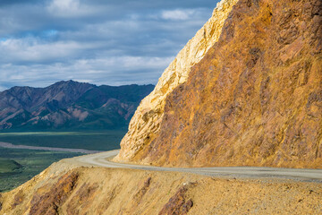 Curved Road on the edge of a cliff, sharp turn around mountain, in Denali National Park, Alaska