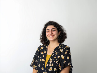  A portrait of a young, happy woman looking directly at the camera, set against a white background, perfect for portrait photography, lifestyle, or personal branding projects