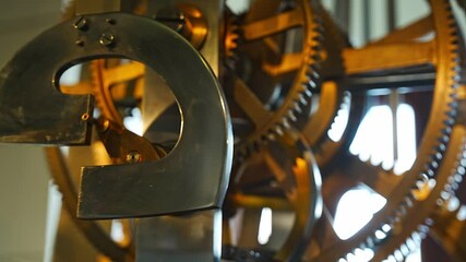 Close-up view of metal parts of the clock mechanism which is located in the Tower in the historical center of Dresden, Germany