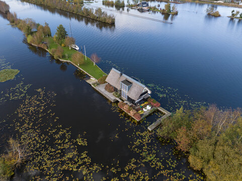 loosdrechtse plassen, water village, house on water, nature of The Netherlands. Breukelen, Scheendijk, aerial drone view.