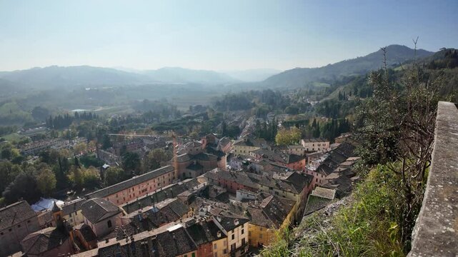 Aerial view of colorful Brisighella village nestled in Lamone valley, showcasing Tuscan romagnolo apennines beauty in emilia romagna, Italy and Brisighella Castle, known as the Rocca Manfrediana in
