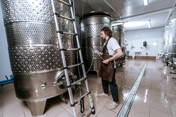 Winemaker Preparing Stainless Steel Fermentation Tank for Process