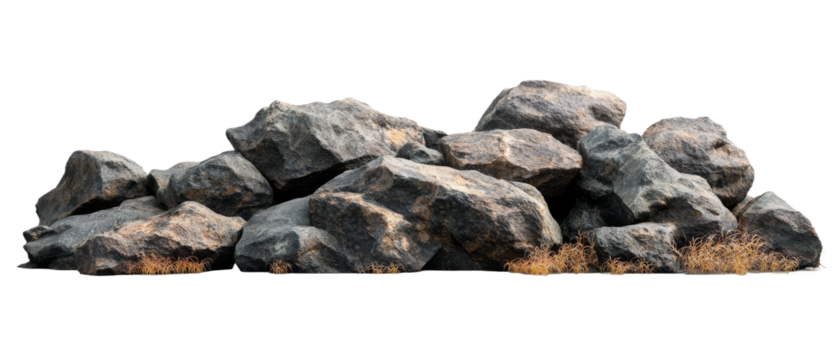 A large cluster of rugged rocks with patches of dry grass in a minimalist setting showcasing natural textures and forms