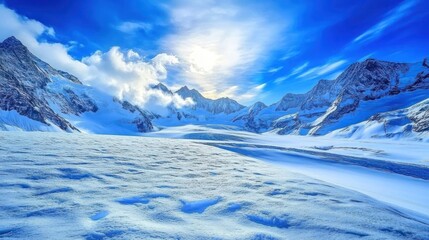 Obraz premium A breathtaking view of a snow-capped mountain range with a glacial lake in the foreground, under a clear blue sky with fluffy white clouds.