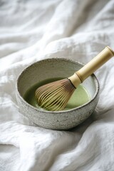 Ceramic Bowl with Matcha Tea and Bamboo Whisk