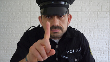 Expressive and funny policeman in uniform