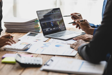Financial advisor meetings are analyzing the market situation and making investment plans to reduce...