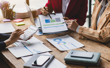 Business team meeting and financial advisor reviewing accounts and analyzing financial reports. Financial planning and business budgets. Auditor team working in office.