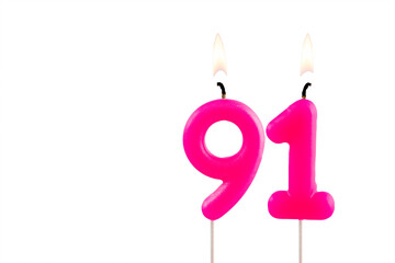 Pink number 91 birthday candle lit on white background