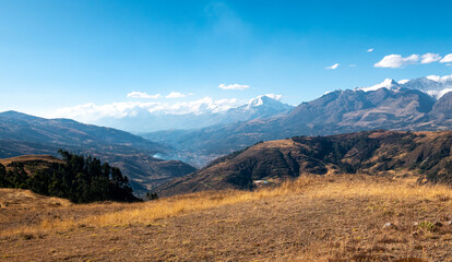 View of the White Mountain Range with Some Clouds Around in a Sunny Day in Huaraz in the Ancash Region, Peru