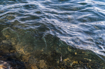 Water blue sea. Lake wave surface. Ocean texture abstract. Waves ripple reflection sunset.