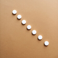 Row, medicine and drugs for health in studio with healthcare wellness, medical painkillers and prescription. Pills, tablets and addiction for treatment, pain remedy and recovery on background