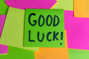 close up handwritten of good luck words text on colorful sticky notes