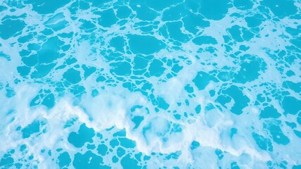 Fototapeta premium Pure blue turquoise water with swirling foam and crashing waves in the ocean, surface, summer, foam