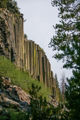 &rlm;Volcanic Hexagons rock formations in California&rsquo;s Devil&rsquo;s Postpiles National Monument. Incredible volcanic hexagons poles standing tall