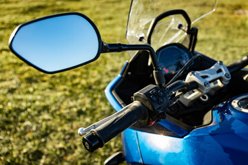 Front view of a motorcycle with mountains in the background.