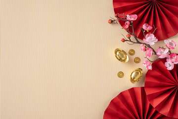 A beautiful Chinese New Year themed arrangement featuring red folding fans, cherry blossoms, and...