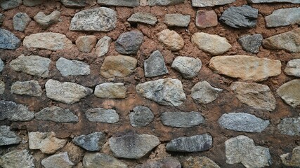 A wall built of stones and earth