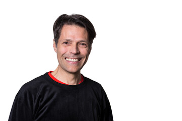Obraz premium Middle-aged man smiling at camera, on white background, wearing casual clothes.