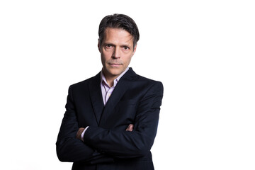 Middle-aged man looking at the camera, arms crossed, on white background, wearing formal clothes.