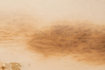Old crumpled beige paper background.
