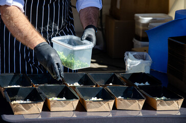 Close-up of the process of cooking food in an outdoor open kitchen