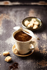 Mug of coffee on rustic wooden background. Copy space.
