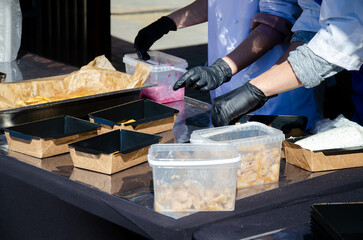 Close-up of the process of cooking food in an outdoor open kitchen